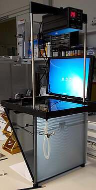 Image of a ripple tank, a shallow transparent tray filled with water used to study wave behavior. 