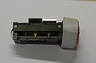 Photo of emission mirrors of a laser scanning microscope. Two mirrors attached to a black holder are visible.